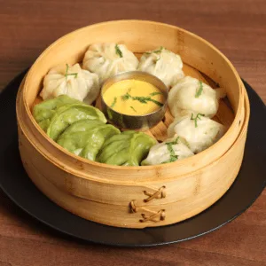 Steamed momos with tomato sesame chutney | Annapurna East Sheen Nepalese Restaurant