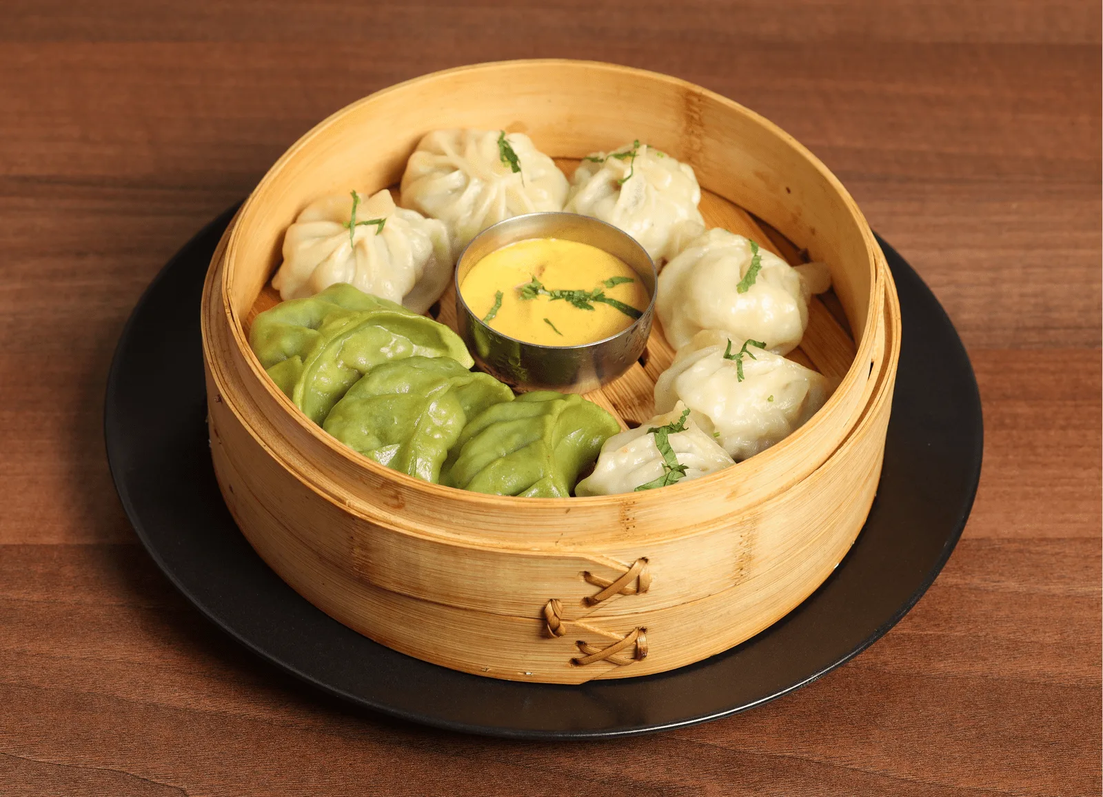 Steamed momos with tomato sesame chutney | Annapurna East Sheen Nepalese Restaurant